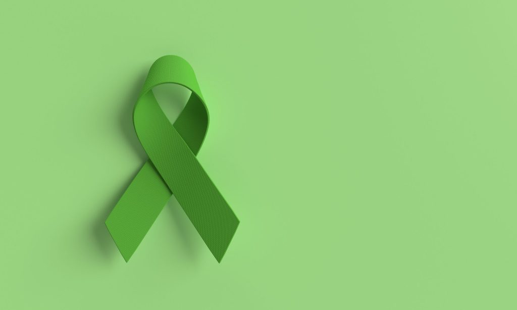 Green ribbon symbolizing support during Mental Illness Awareness Week